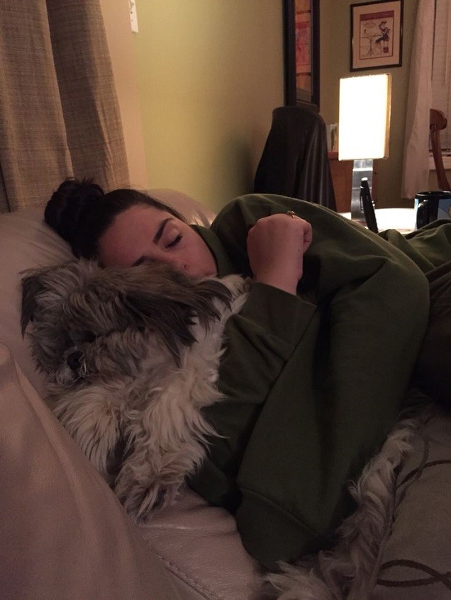 woman nap time shih tzu dog