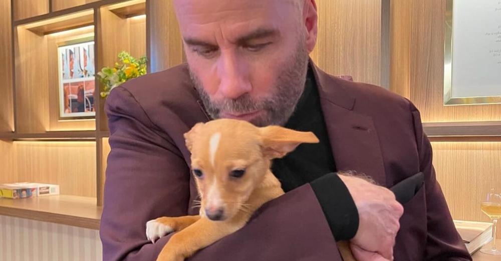 John Travolta shares sweet throwback pic with rescue dog Peanut: “She’s brought the biggest joy to our family”