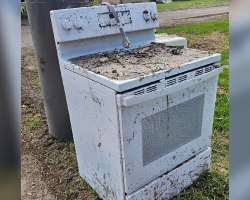 Cleanup Crew Opens Flood-Wrecked Oven — And A Miracle Cat Jumps Out